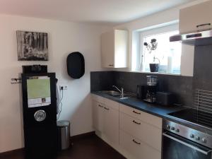 Η κουζίνα ή μικρή κουζίνα στο Ferienwohnung Rothaargebirge +33 φωτογραφίες