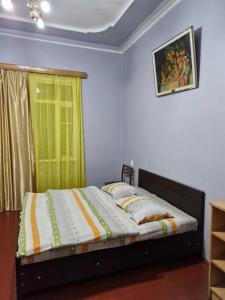 Postel nebo postele na pokoji v ubytování Joni Guest House