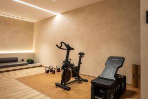 a room with a gym with a exercise bike at Ormus Villa - Beachfront Sanctuary Blending with Earth, Sun & Sea by etouri in Panormos Rethymno +101 photos