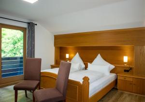 Postel nebo postele na pokoji v ubytování Ferienhaus Wetterstein + 54 fotografií