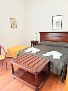 Letto o letti in una camera di Hotel Archimede Ortigia
