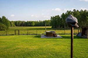 a baseball cap on a stick in a field at Brzozowa Polanka in Lipowiec Stary