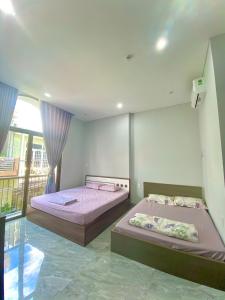 En eller flere senge i et værelse på HG House