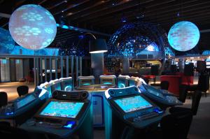a room with a bunch of video game machines at Troia Design Hotel in Troia
