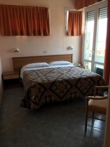 Postel nebo postele na pokoji v ubytování Hotel Ambasciatori