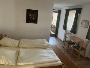 Postel nebo postele na pokoji v ubytování Hacker-Alm