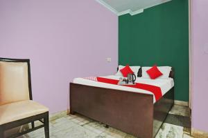 Postel nebo postele na pokoji v ubytování Hotel O Padam Residency