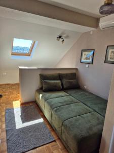 Postel nebo postele na pokoji v ubytování Apartmani Filip