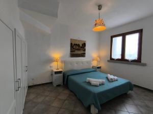 Postel nebo postele na pokoji v ubytování Tanca Piras - Emozioni a strapiombo sul Mare!!!