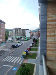 a view of a city street with parked cars at El encanto del Texu in Pola de Lena