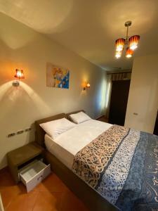 a bed in a bedroom with two lights and a bed sidx sidx sidx at بورتو السخنه اكوا بارك in Ain Sokhna