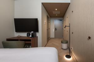 TV a/nebo společenská místnost v ubytování Hotel De Zeevaartschool