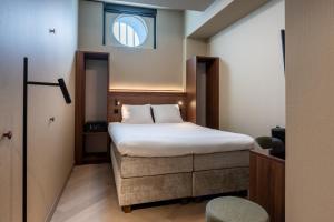 Postel nebo postele na pokoji v ubytování Hotel De Zeevaartschool