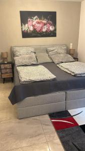 a large bed in a room with at Quiet 1-Bedroom Apartment - Ideal for small Familiy & Work Stays in Munich