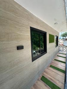 a house with a window on the wall at Bhurban Suites in Bhurban