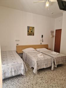 Postel nebo postele na pokoji v ubytování Hotel AnnaMare + 32 fotografií