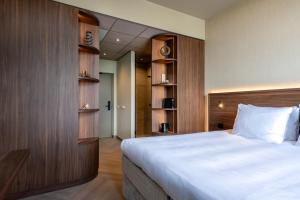 Postel nebo postele na pokoji v ubytování Hotel De Zeevaartschool