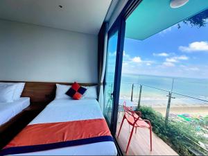 Ένα ή περισσότερα κρεβάτια σε δωμάτιο στο Flamingo Ibiza Hai Tien Luxury Resort