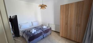 Posteľ alebo postele v izbe v ubytovaní Mykonian Tramonti Villas