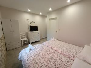 Łóżko lub łóżka w pokoju w obiekcie Pension Doña Lubina