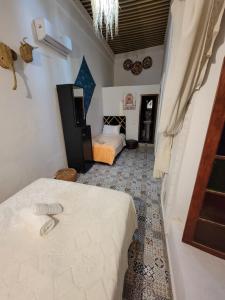 Postel nebo postele na pokoji v ubytování RIAD Belkayed Fez + 21 fotografií