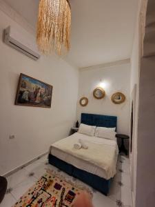 Postel nebo postele na pokoji v ubytování RIAD Belkayed Fez