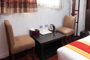 Rúm í herbergi á Hotel Kathmandu square