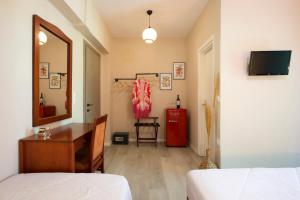 Postel nebo postele na pokoji v ubytování Hotel Kastri