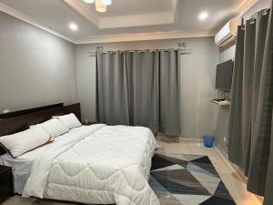 Postel nebo postele na pokoji v ubytování IBEX Hill Apartments and Lodges