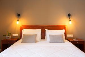 Postel nebo postele na pokoji v ubytování Hotel Kastri