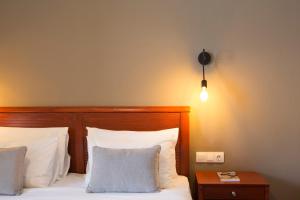 Postel nebo postele na pokoji v ubytování Hotel Kastri