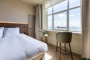 Postel nebo postele na pokoji v ubytování Hotel De Zeevaartschool