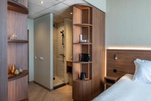 Postel nebo postele na pokoji v ubytování Hotel De Zeevaartschool