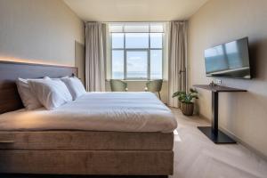Postel nebo postele na pokoji v ubytování Hotel De Zeevaartschool
