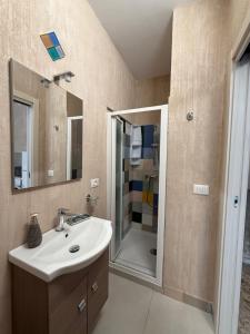 a bathroom with a sink and a shower at Case Vacanze Sant'Agostino in Pizzo +44 photos