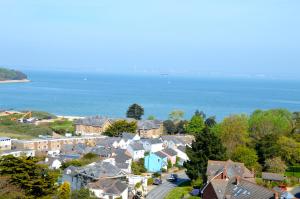 an aerial view of a town with houses and the ocean at The Pilot Boat Inn, Isle of Wight in Bembridge +17 photos