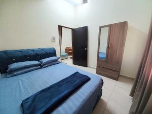 Ένα ή περισσότερα κρεβάτια σε δωμάτιο στο DC Garden Homestay - wifi, netflix