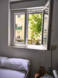 Postel nebo postele na pokoji v ubytování Agui House