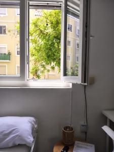 Postel nebo postele na pokoji v ubytování Agui House