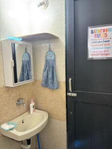 a bathroom with a sink and a mirror at Tranquil Trails-Suprabha Villa-Nashik in Nashik +93 photos