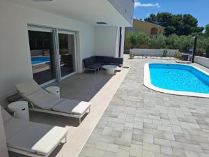 Φωτογραφία από το άλμπουμ του Villa Plesa with office and private pool σε Povljana