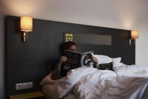 Postel nebo postele na pokoji v ubytování Collina Hotel Garni