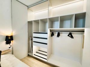 Postel nebo postele na pokoji v ubytování Appartement séduisant Paris - Clichy