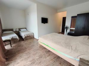 Postel nebo postele na pokoji v ubytování KARD HOUSE