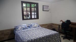 Postel nebo postele na pokoji v ubytování Quarto em casa na Mata Atlântica