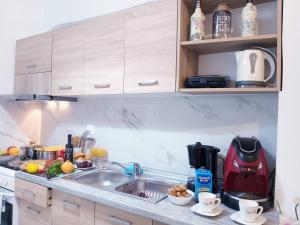 A kitchen or kitchenette at Angelina's cosy apartment in Corfu town