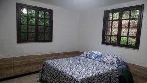 Postel nebo postele na pokoji v ubytování Quarto em casa na Mata Atlântica