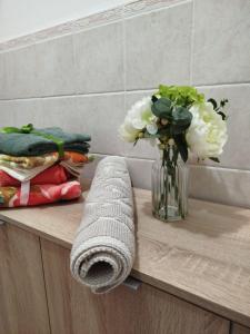 a vase of flowers on a counter with a vase of flowers at Villa Marta in Città della Pieve +48 photos