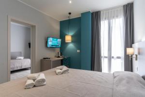 A bed or beds in a room at Hotel Cristina