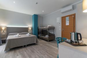 A bed or beds in a room at Hotel Cristina